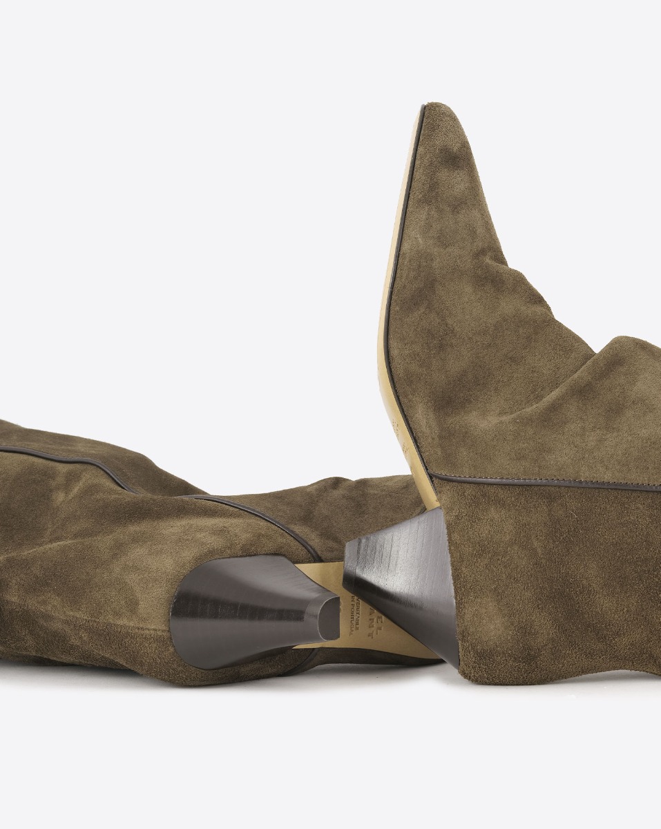 Bottes Elita Isabel Marant en cuir suédé bronze. Détail des semelles en cuir.