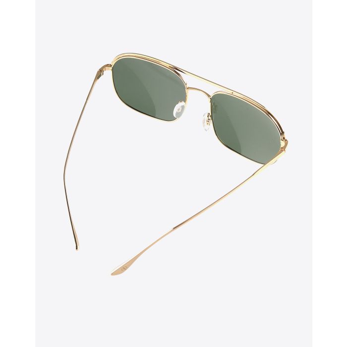 Lunettes Highland Anine Bing dorées. 
