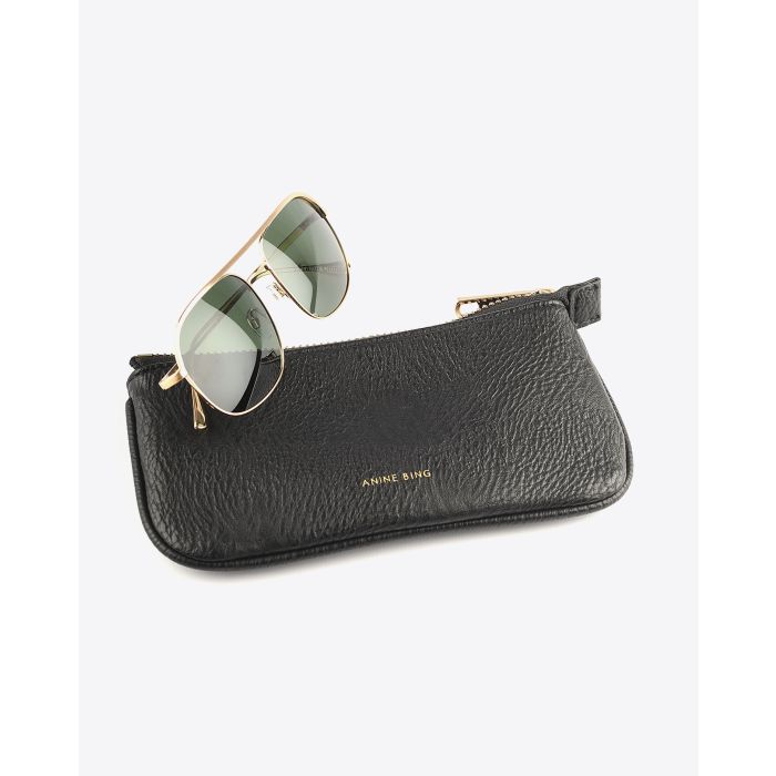 Lunettes Highland Anine Bing dorées. 
