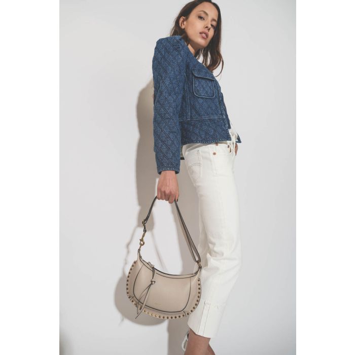 Veste près du corps matelassée en jean bleu Deliona Isabel Marant Etoile.  Porté avec un sac Isabel Marant.