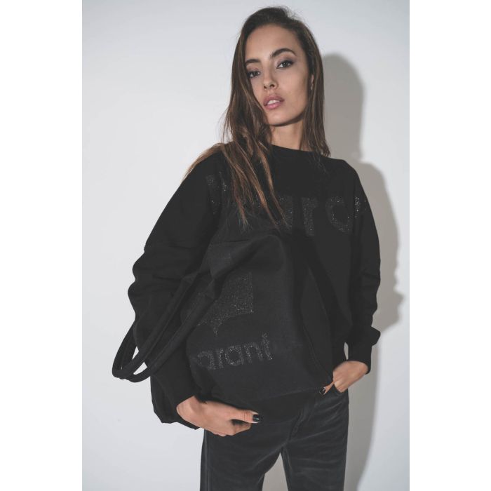 Grand cabas en toile noir logo MARANT à paillettes noires Yenky Isabel Marant. Porté sous le bras.