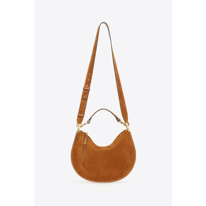Sac Oskan Soft Zip Isabel Marant en cuir suédé cognac et tressé. Petite anse porté main ou épaule et bandoulière pour un porté épaule ou croisé. Détail de la bandoulière longue. Face.