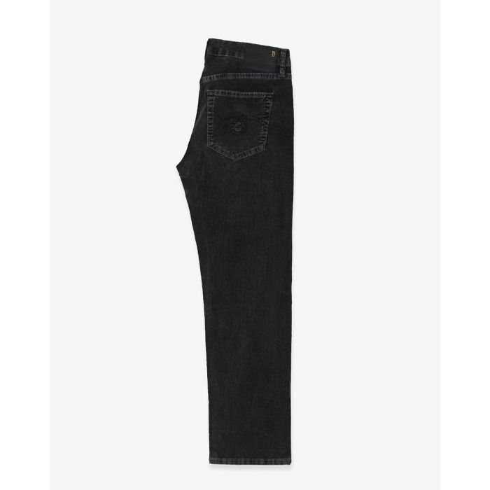Jean slim taille basse Boy Straight R13 en velours de coton côtelé noir délavé Obsidian Stretch Cord Black. Vue de profil.