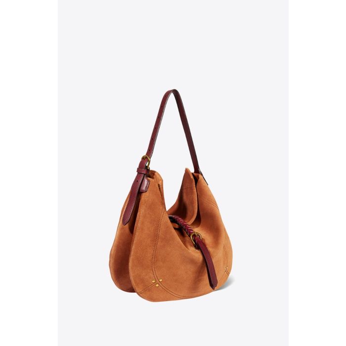 Sac Luis Jérôme Dreyfuss en cuir suédé caramel. Forme besace souple à bandoulière porté main, épaule ou croisé. Détail de la anse courte. Profil. 
