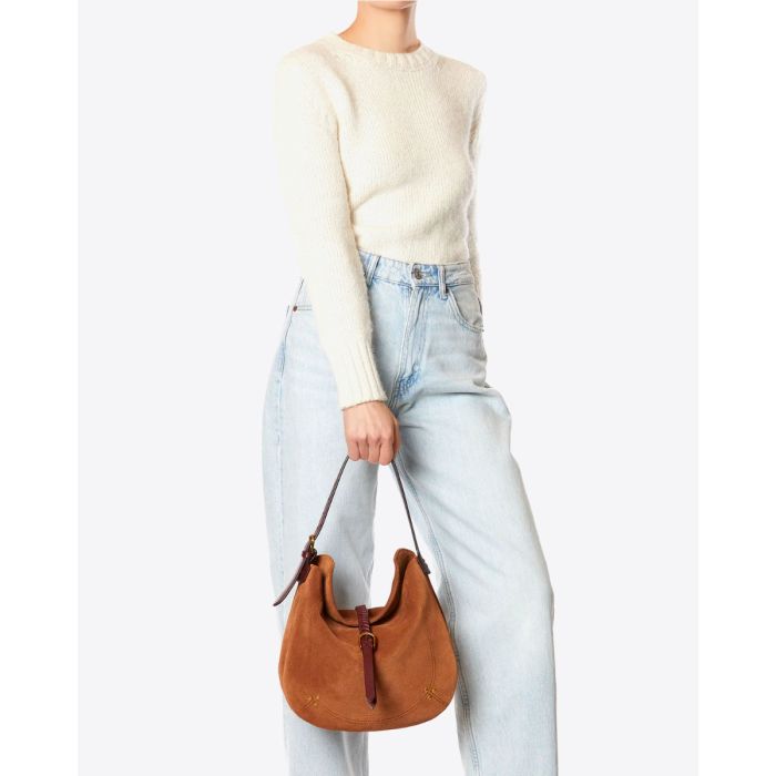 Sac besace Luis Jérôme Dreyfuss en cuir suédé caramel porté main.