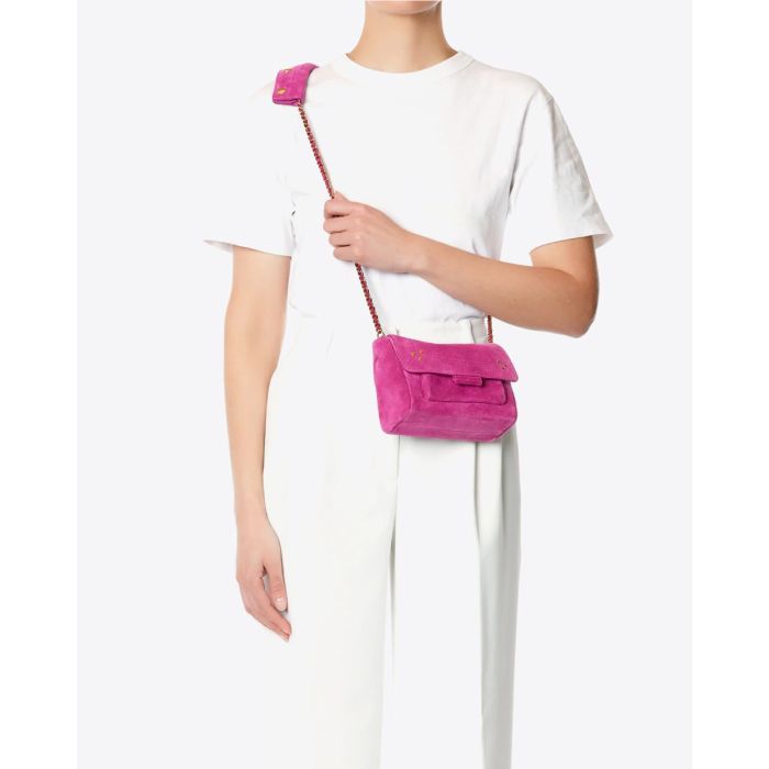 Sac Lulu S Jérôme Dreyfuss en cuir suédé rose orchidée porté croisé.