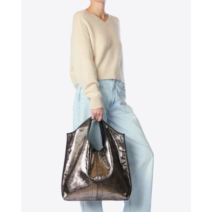 Sac Paco Jérôme Dreyfuss en cuir lamé champagne. Vue porté main. 