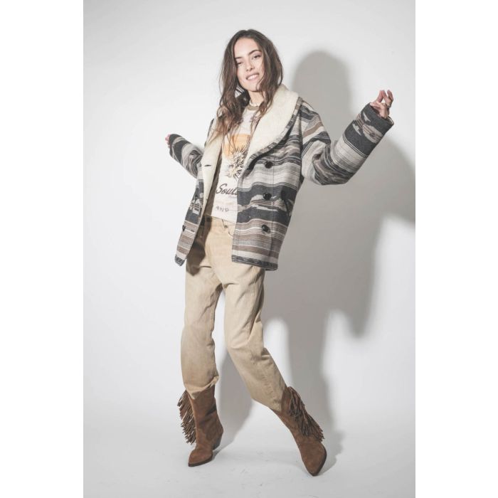 Jean Crossover R13 en toile beige Faded Wheat. Porté avec des santiags.