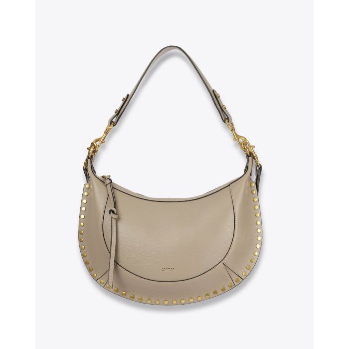 Sac Naoko Isabel Marant en cuir grainé taupe. Anse courte et bandoulière longue amovible et réglable. Porté épaule et main ou épaule et croisé. Face. Anse courte.