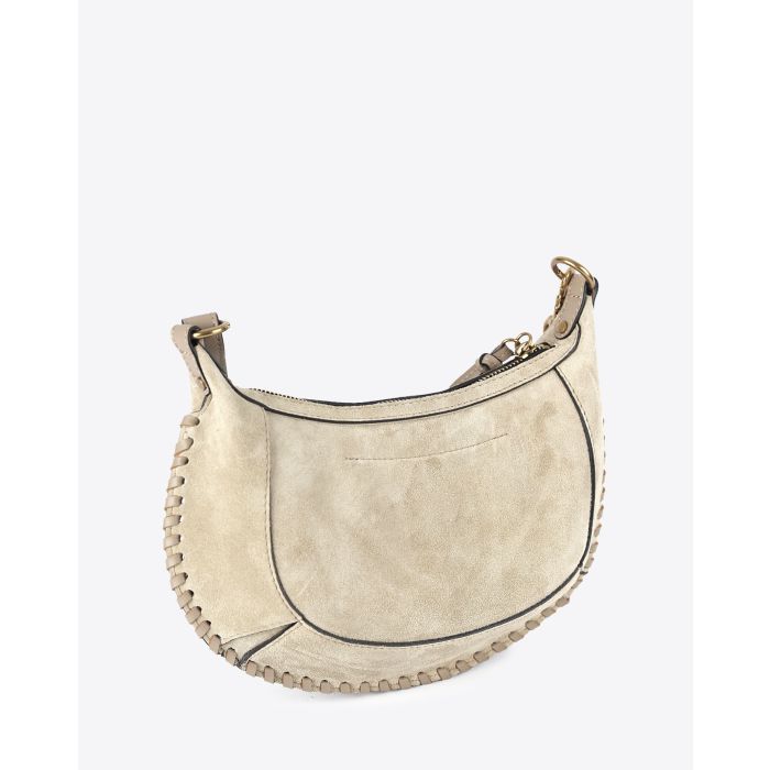 Sac lune Oskan Isabel Marant en cuir de veau suédé beige clair. Vue profil.