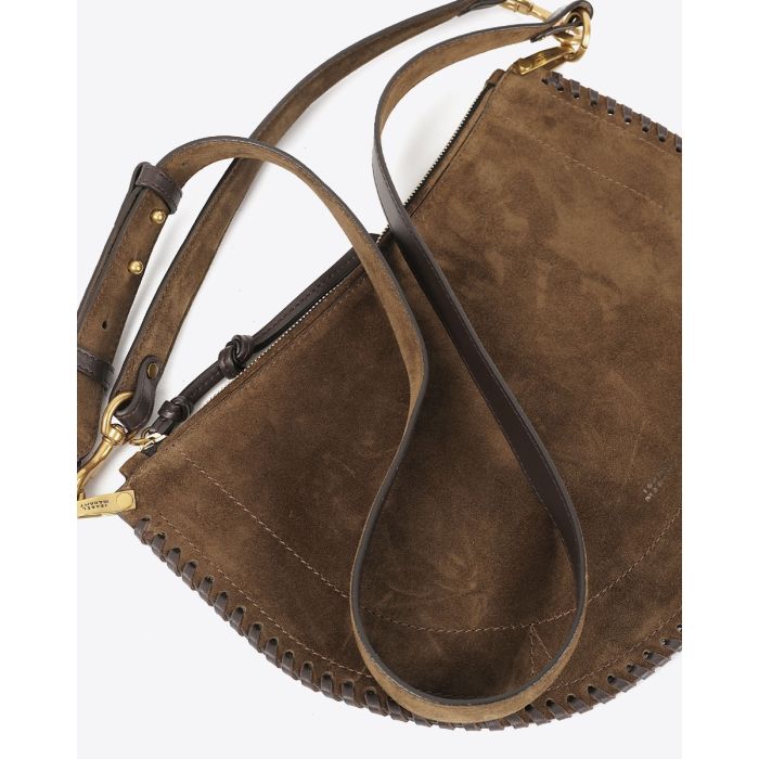 Sac Oskan Soft zip Isabel Marant en cuir suédé bronze et tressé. Anse en cuir porté main ou épaule et bandoulière en cuir amovible et réglable pour un porté épaule ou croisé. Détail de la anse. Face. Détail du cuir suédé.