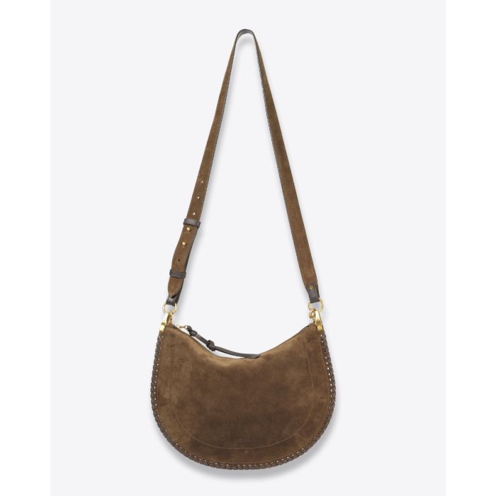 Sac Oskan Soft zip Isabel Marant en cuir suédé bronze et tressé. Anse en cuir porté main ou épaule et bandoulière en cuir amovible et réglable pour un porté épaule ou croisé. Détail de la anse. Face. Bandoulière longue. 