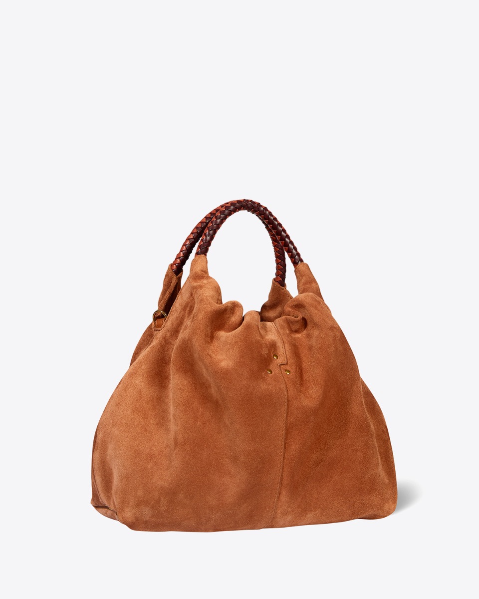 Sac Gordi M Jérôme Dreyfuss en cuir suédé caramel. Anses rondes en cuir tressé et bandoulière longue amovible. Porté main, épaule ou croisé. Profil.