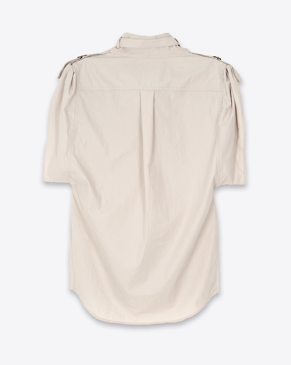 Top Nemia Isabel Marant Etoile en coton craquant écru. Top sans manches col montant avec passants et sangles coupe ample. Dos. Détail du plis milieu dos. 